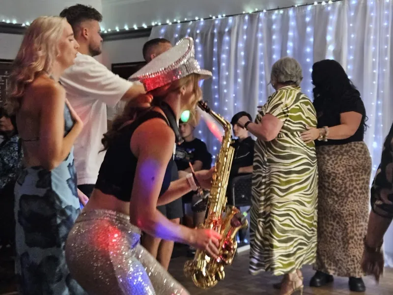 Alice Sax performing at an event