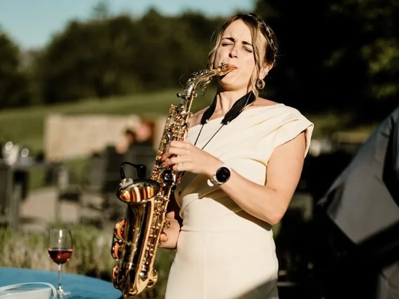 Saxophone player playing outside at The Coniston Hotel